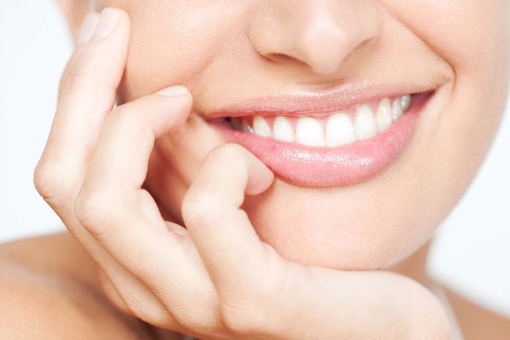 Up close shot of woman’s smile with white teeth