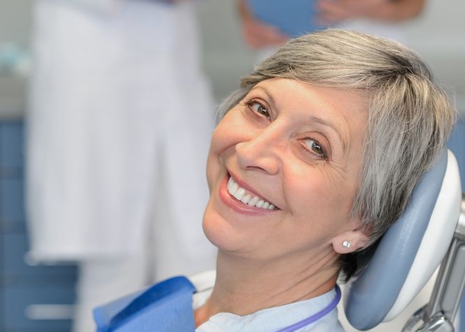 An older patient in a dental chair